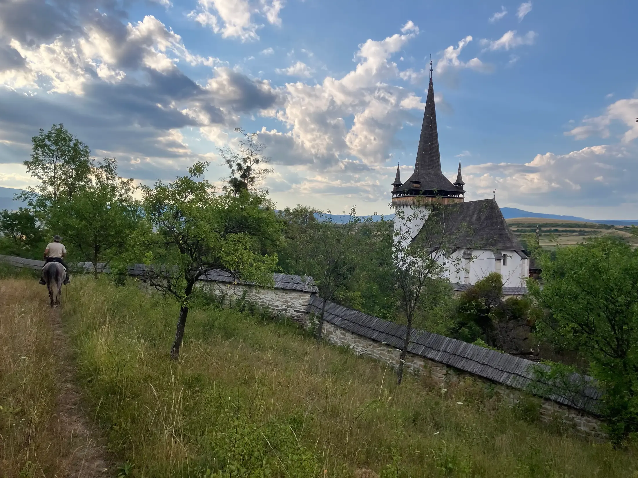 Rider travelling through a Transylvanian mountain landscape