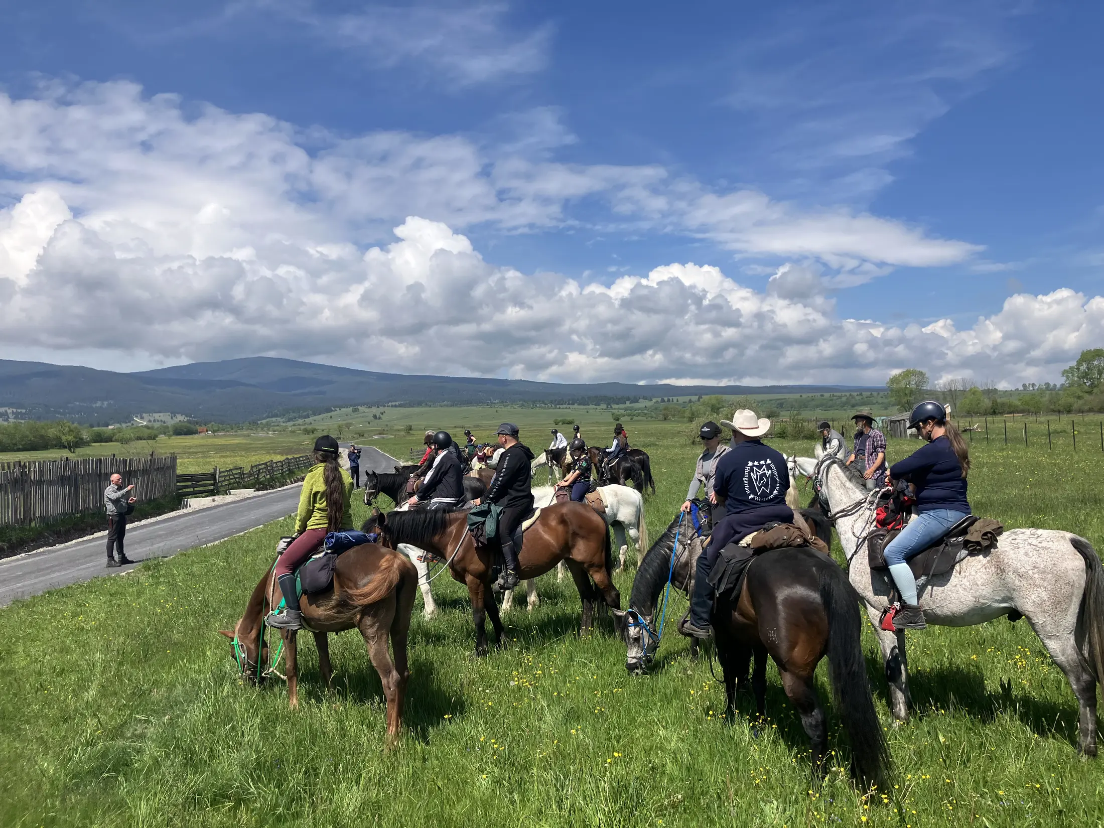 Illustrated riders crossing open Transylvanian grassland
